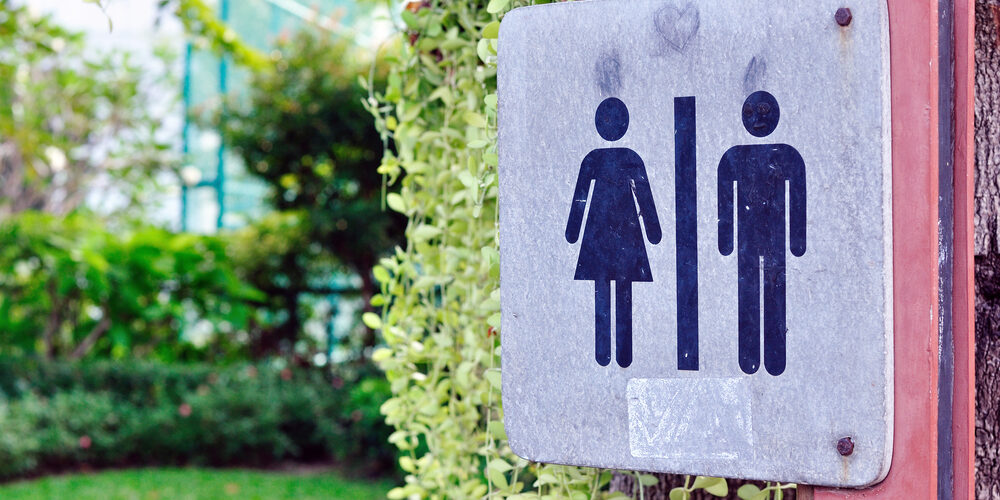 Women and men toilet sign in garden